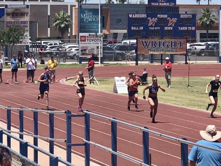 Runners running on a racetrack