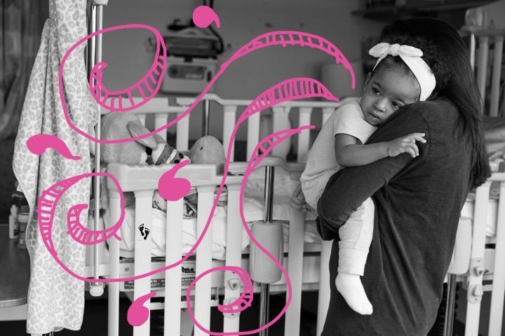 Mom holding daughter Briana outside of her crib