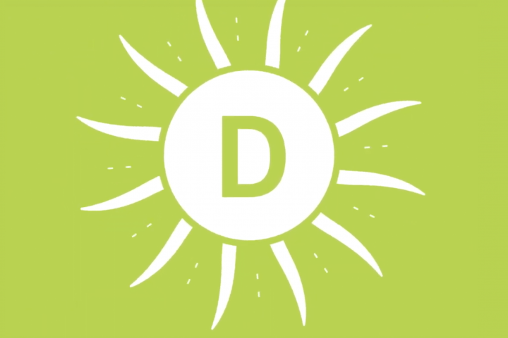 White sun over green background (vitamin D)