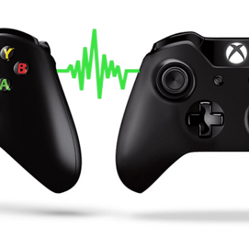 Photo of two xbox controllers connected by a green squiggly line.
