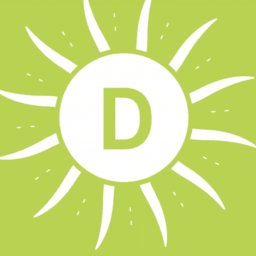 White sun over green background (vitamin D)