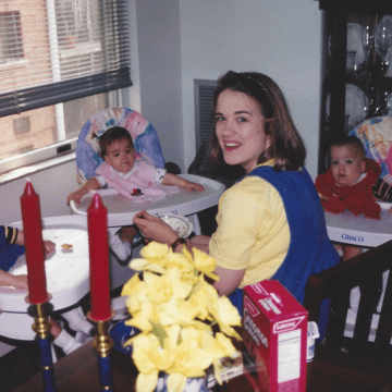 Mom feeding her three babies