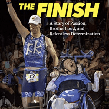 Beyond the Finish Book Cover with photo of two men in blue on a podium, one man is in a wheelchair