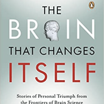 Book Cover: The Brain that Changes Itself with the image of a human head at the center of the word brain.