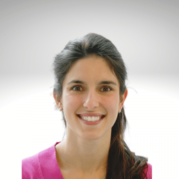 Jennifer Jezequel has long brown hair and is smiling wearing a pink sweater