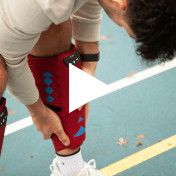 Thumbnail image of boy adjusting knee sleeve