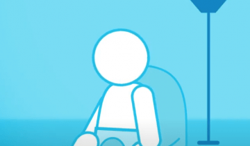Representation of an infant seated near a lamp