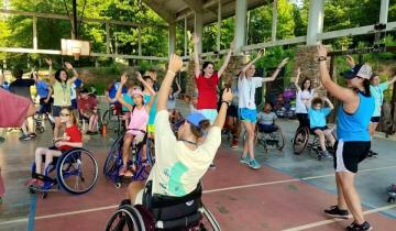 Individuals in wheelchairs participating in a fitness class