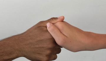 Photo of hands shaking.
