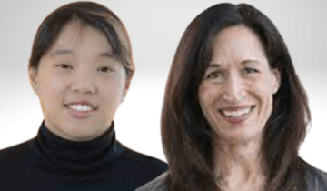 Debbie Song has dark hair pulled back and is wearing a black turtle neck. She is standing next to Marie Ward who has long dark hair and is wearing a grey blazer over a black shirt.