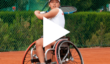 Thumbnail of woman in wheelchair playing a sport with play button overlayed