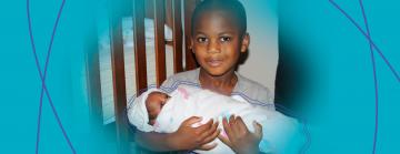 Brother holding his sister Tylynn (3 months old)