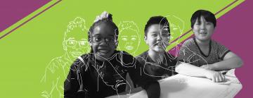 Three kids (age 9) sitting at their desks smiling