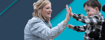 Mom and her son giving high fives