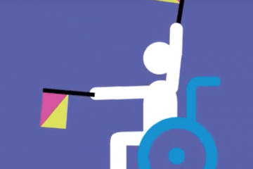 Child in wheelchair raising flags