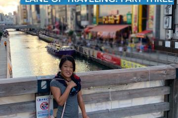 "A Trip Down the Memory Lane of Travel: Part Three" written in text above an image of writer, Sarah Kim, in front of a river in Japan